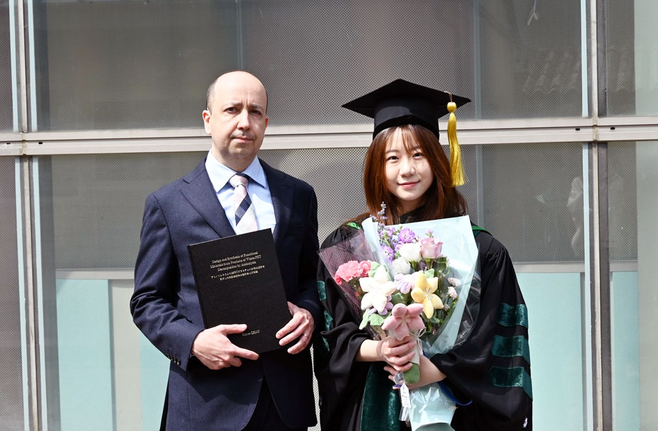 Anatoly Zinchenko with Kayee Chan in academic dress at her doctoral graduation